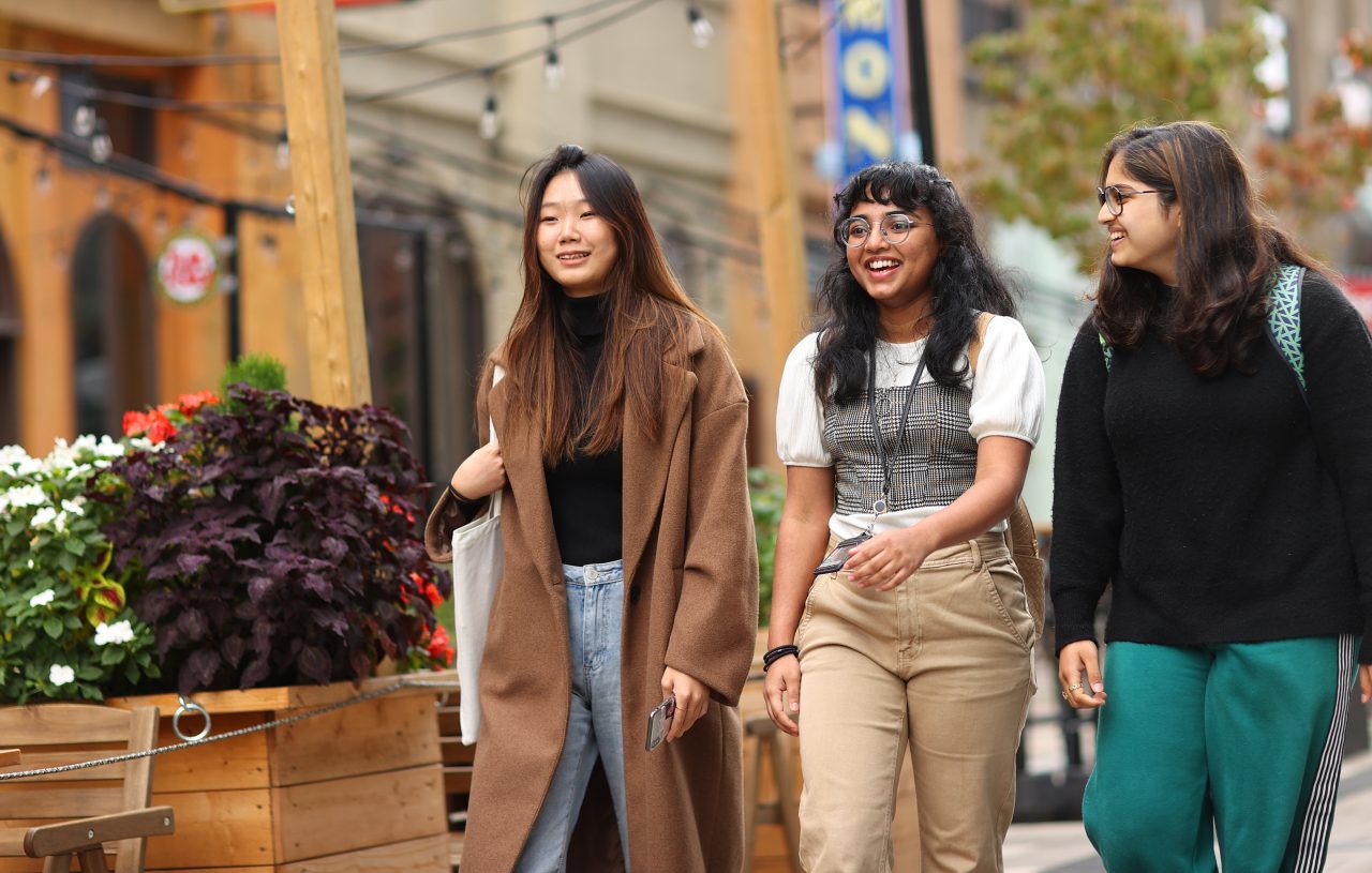 Three students walking in downtown Halifax three students walking on a street in downtown Halifax