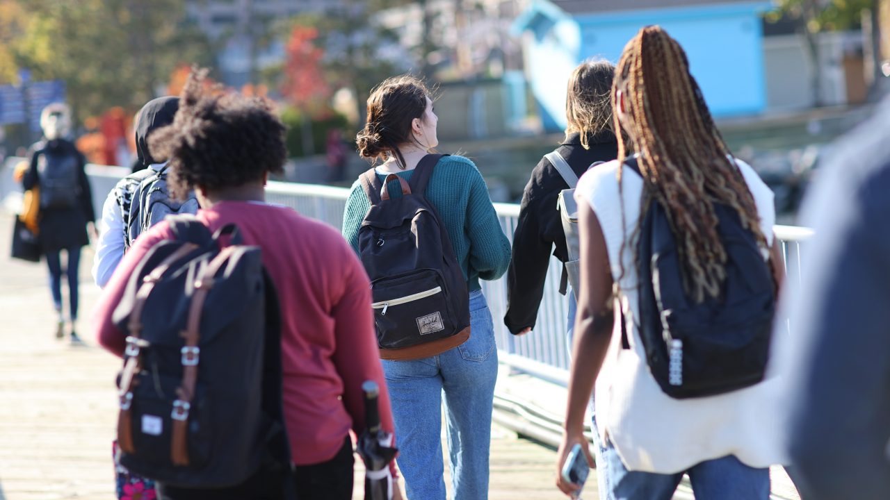 Dal students walking wearing backpacks