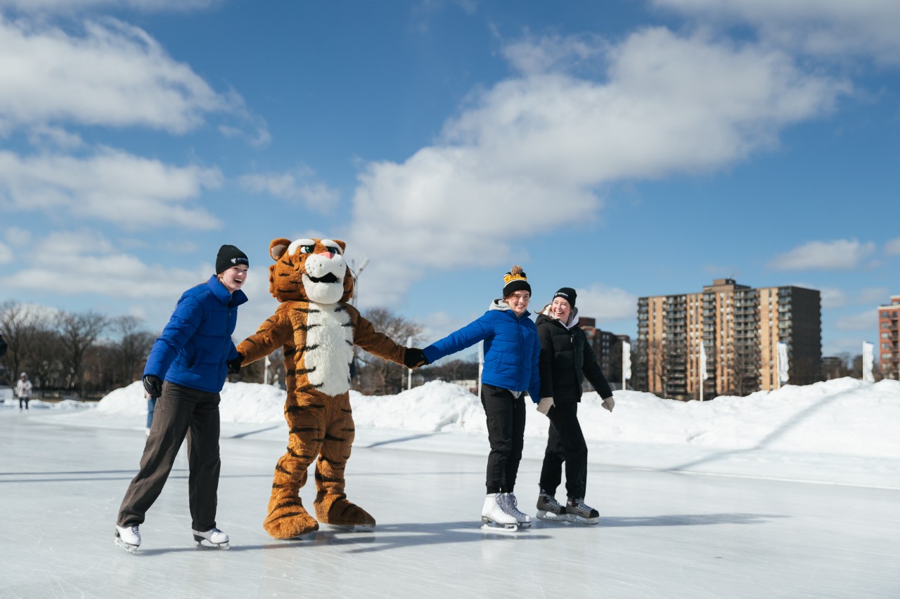 students and Dal tiger skating at the Oval
