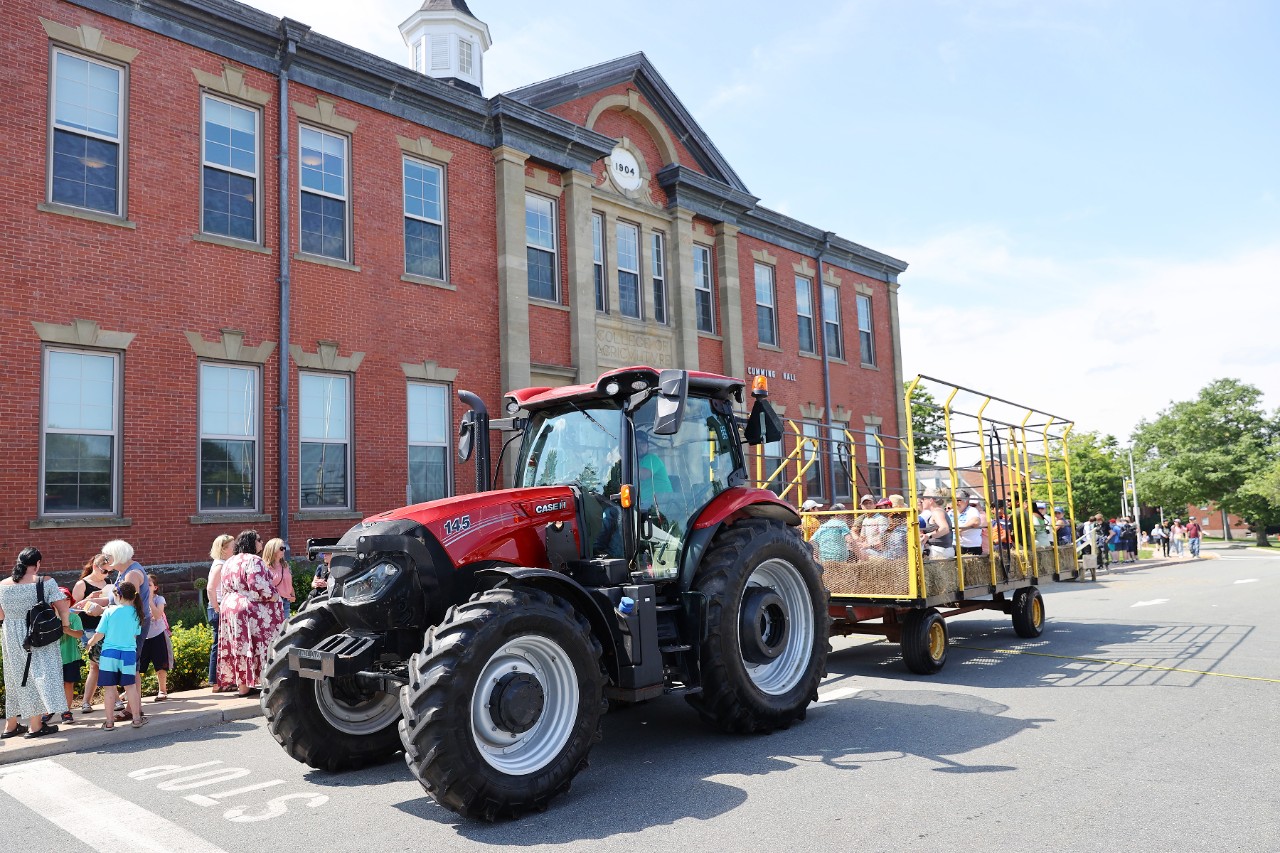 tractor wagon ride outside Cumming Hall