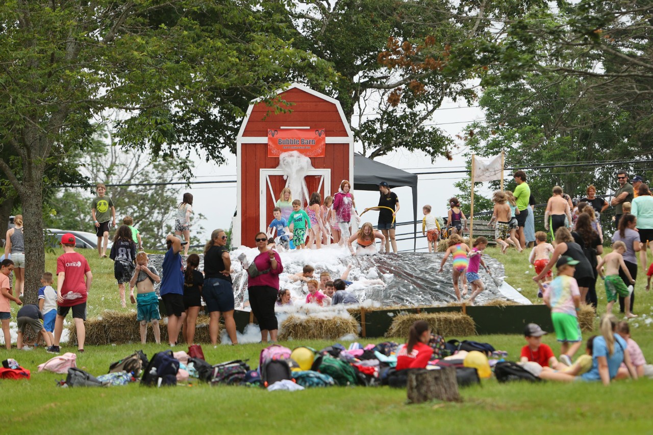 Kids playing in the bubble barn at community day
