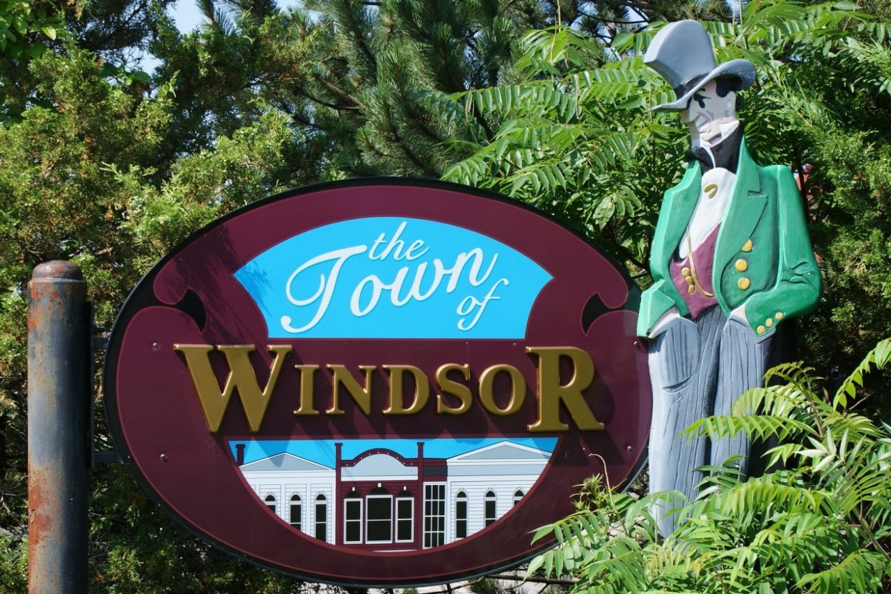Town of Windsor sign with a figure in a green coat and top hat.