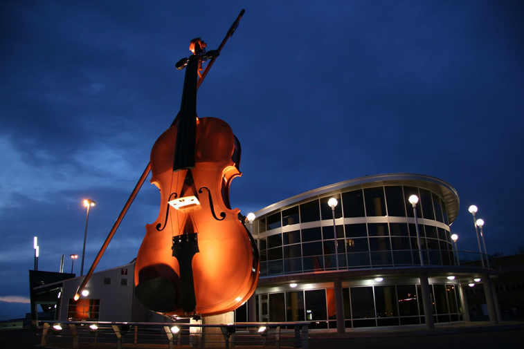 Large fiddle structure beside a building in downtown Sydney