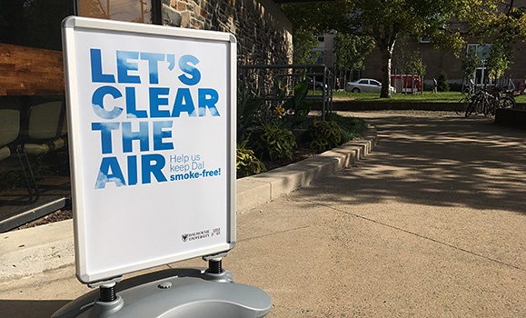 Sign on campus reads Let's Clear the Air: help us keep Dal smoke free!