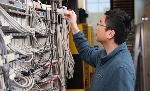 Dr. Chongyin Yang in Dalhousie's current battery testing lab