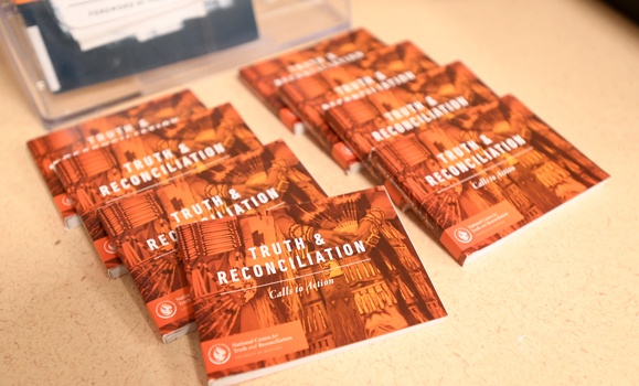 Booklets highlighting the Truth and Reconciliation Commission of Canada's Calls to Action are displayed on a table. (Provided photos)