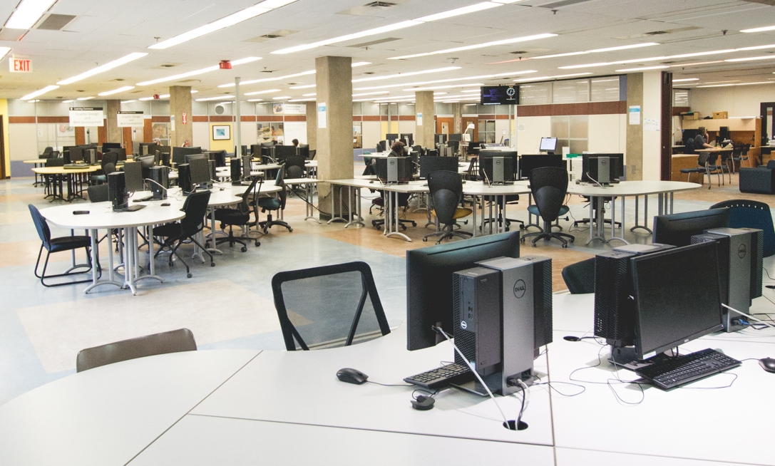 A lab full of computer working stations.