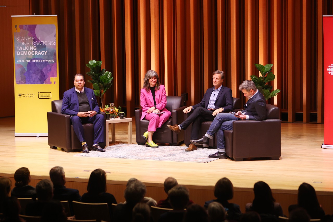 The speakers and moderator of the 2023 Stanfield Conversation are seated on stage. 
