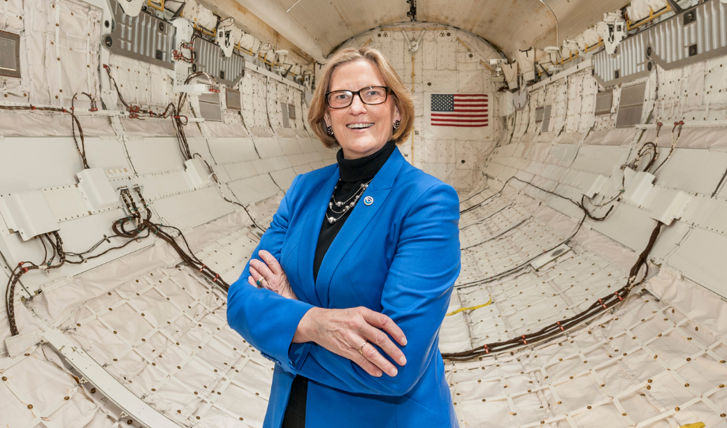 Dr. Kathryn Sullivan stands insight the Space Shuttle Discovery.