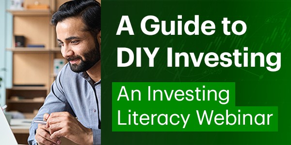 A man is focusing on something on his screen with a slight smile beside marketing copy.