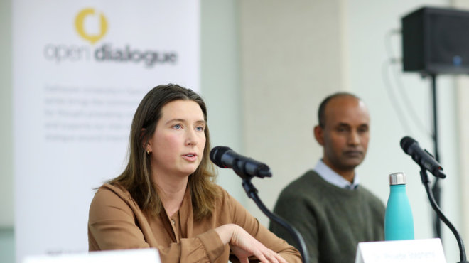 Two panelists speaking at Open Dialogue