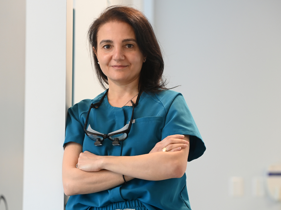 Arum Award Winner Nada Haidar posing in medical scrubs