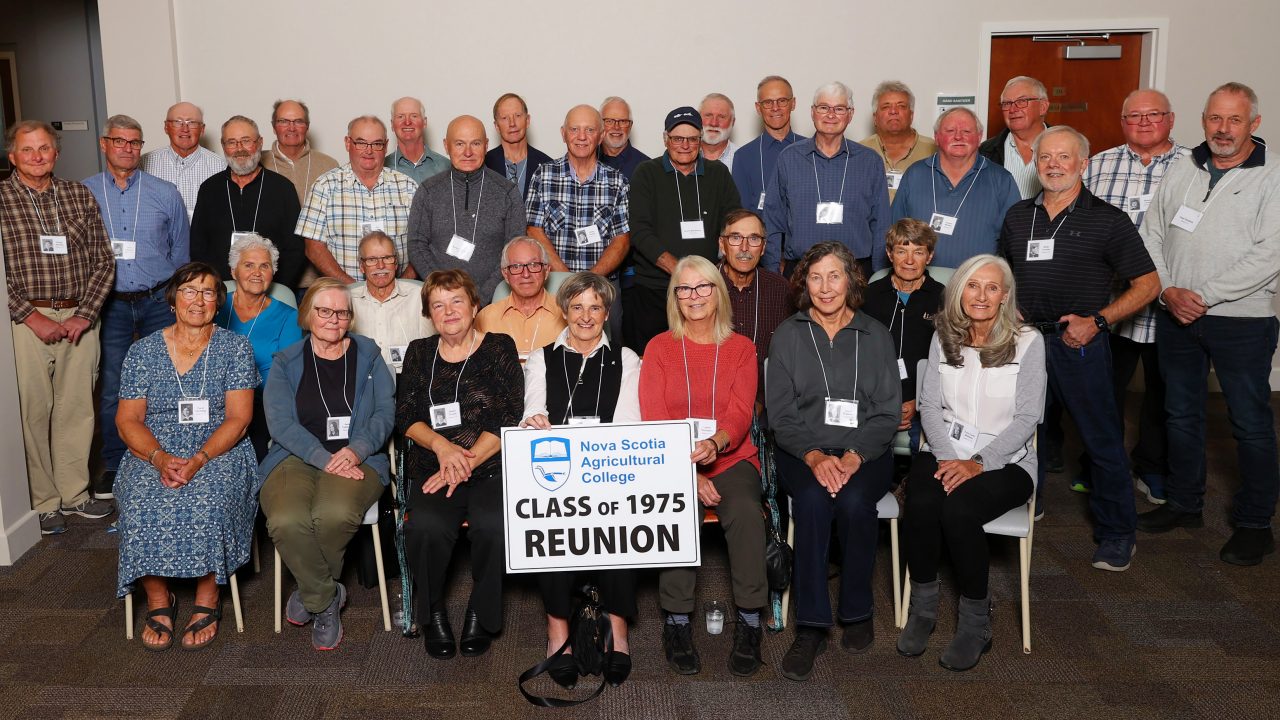 The class of 1975 posing for a reunion photo