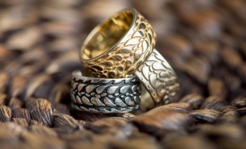 Three alumni rings stacked