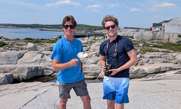 Dal Commerce student Jake Zavislake, left, and brother Quin set up a photo shoot for their Ace Brewer coffee system at Peggy's Cove.