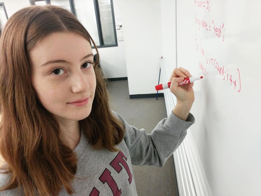 Tabea Marzlin looks up from writing on a whiteboard.
