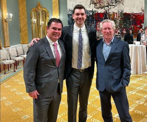 Maloney, Carson and Harvey posing at the event.