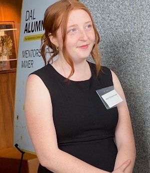 Schoonhoven is standing at the event looking thoughtful.