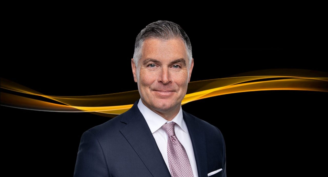 Clint Davis portrait with Aurum Awards gold branding.