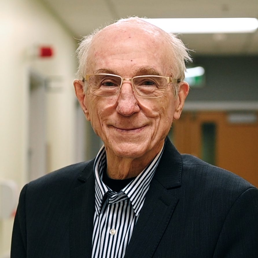 Don Hill stands in a hospital corridor in a suit jacket.