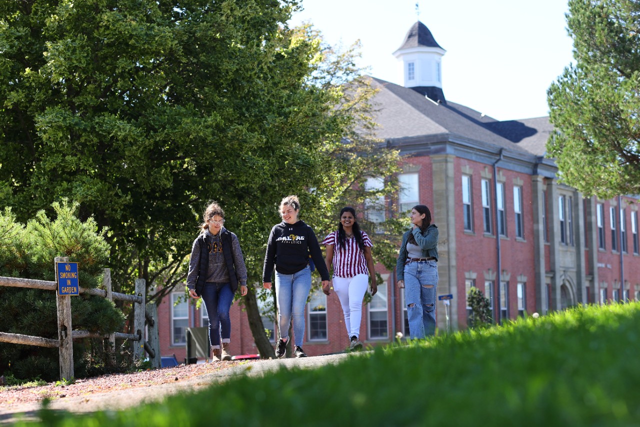 Students walking outside of Cumming Hall.