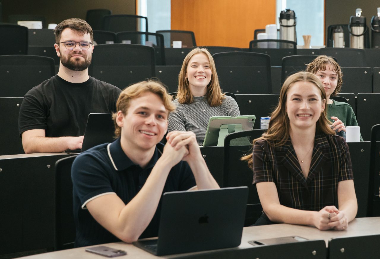 masters students attending a classroom lecture
