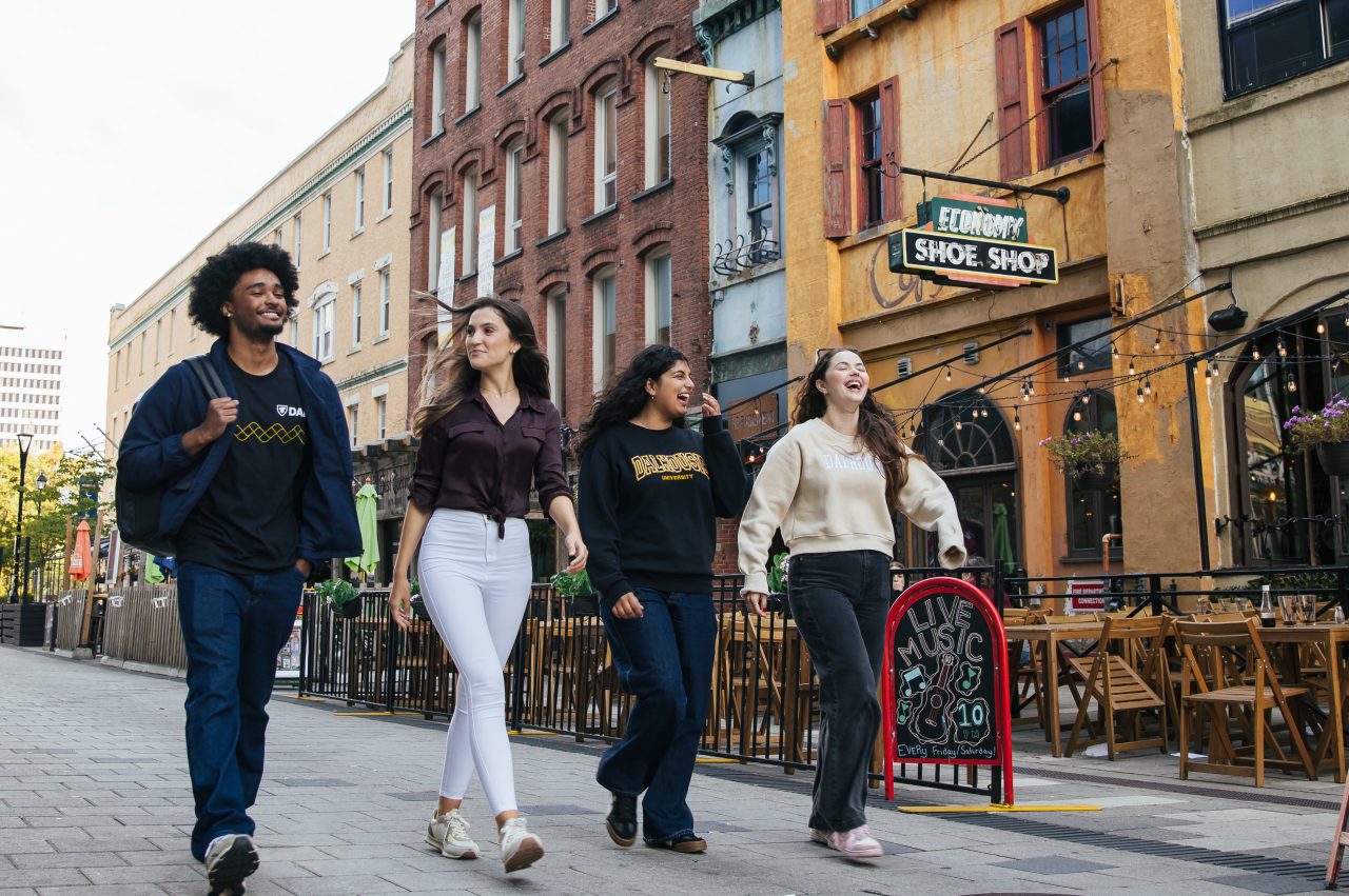 student with backpack smiling