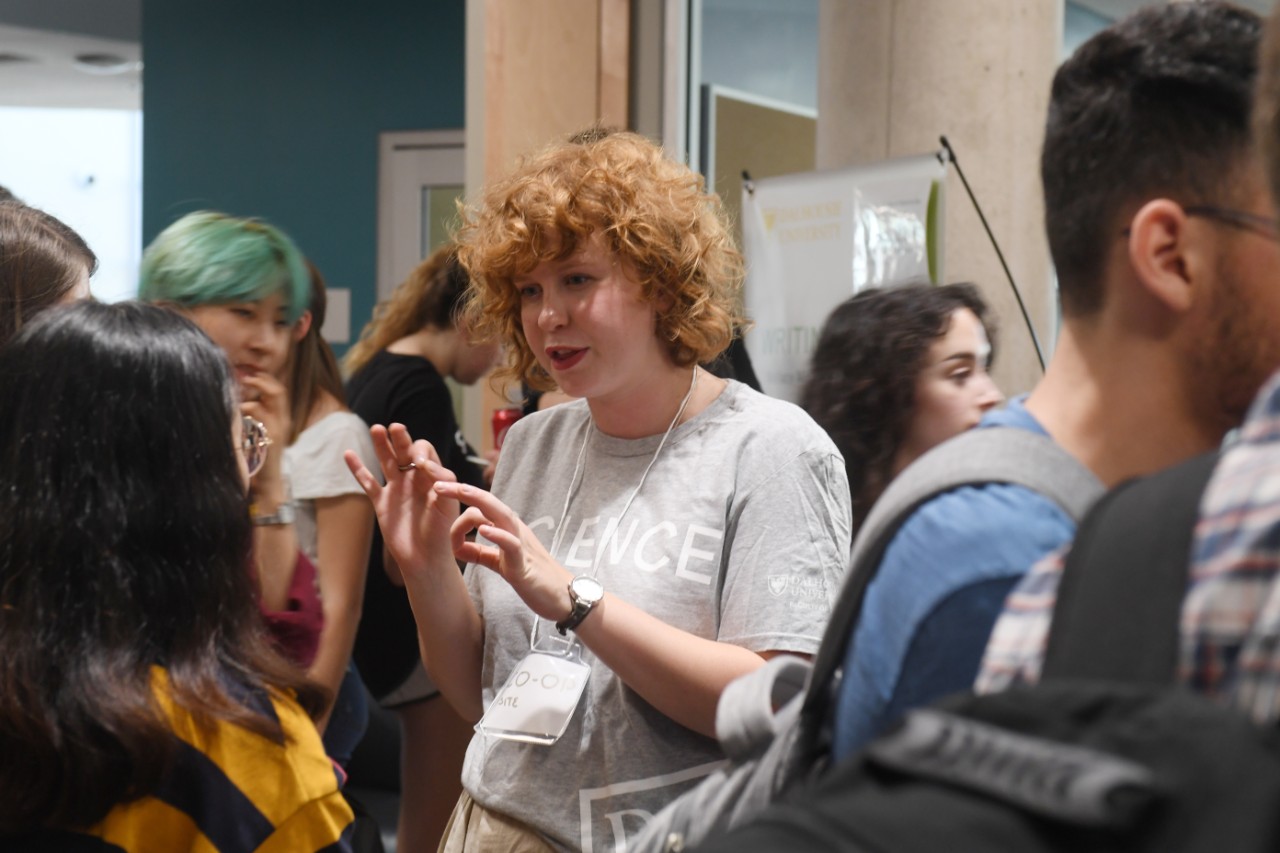 An advisor speaks to students while they attend the Dalhousie Science welcome party