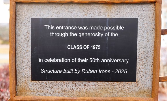 A plaque on the iron arch.