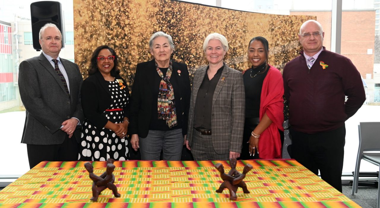 A group of Dalhousie leaders stand with key members of partner groups in the announcement.