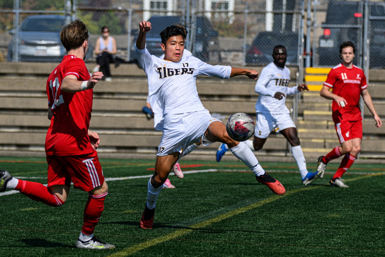 Chen and others playing soccer.