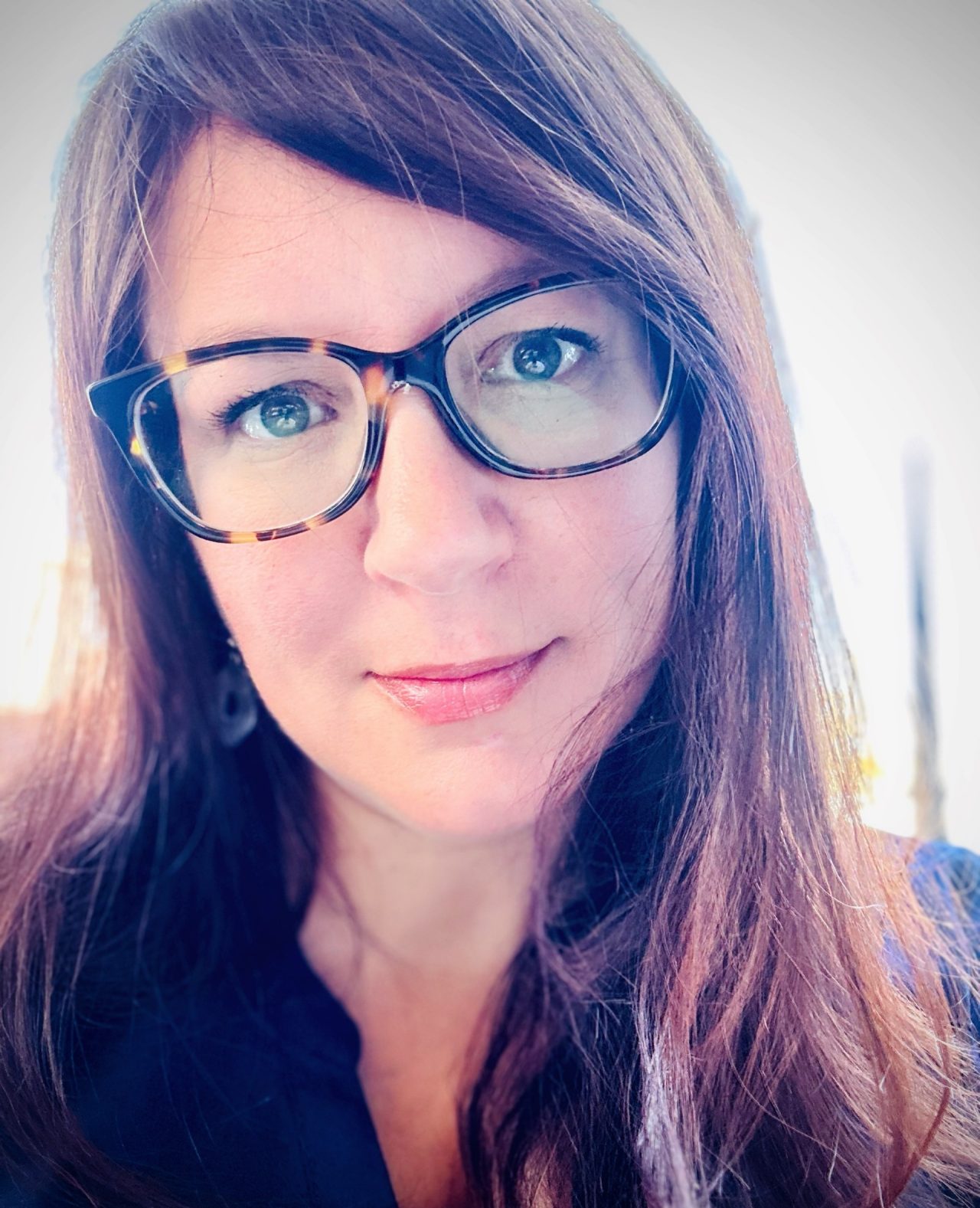 Lori Wozney portrait wearing glasses