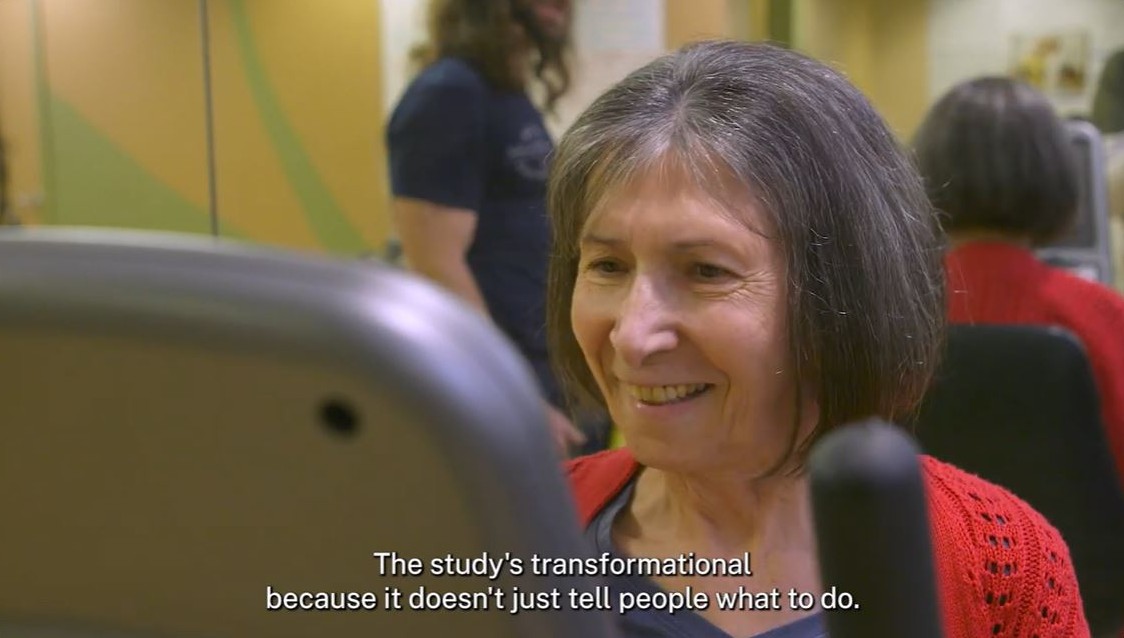Video screen capture of a participant in the STRONG study at an exercise machine.