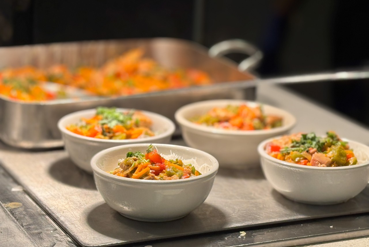 Bowls of colourful food on on a serving counter
