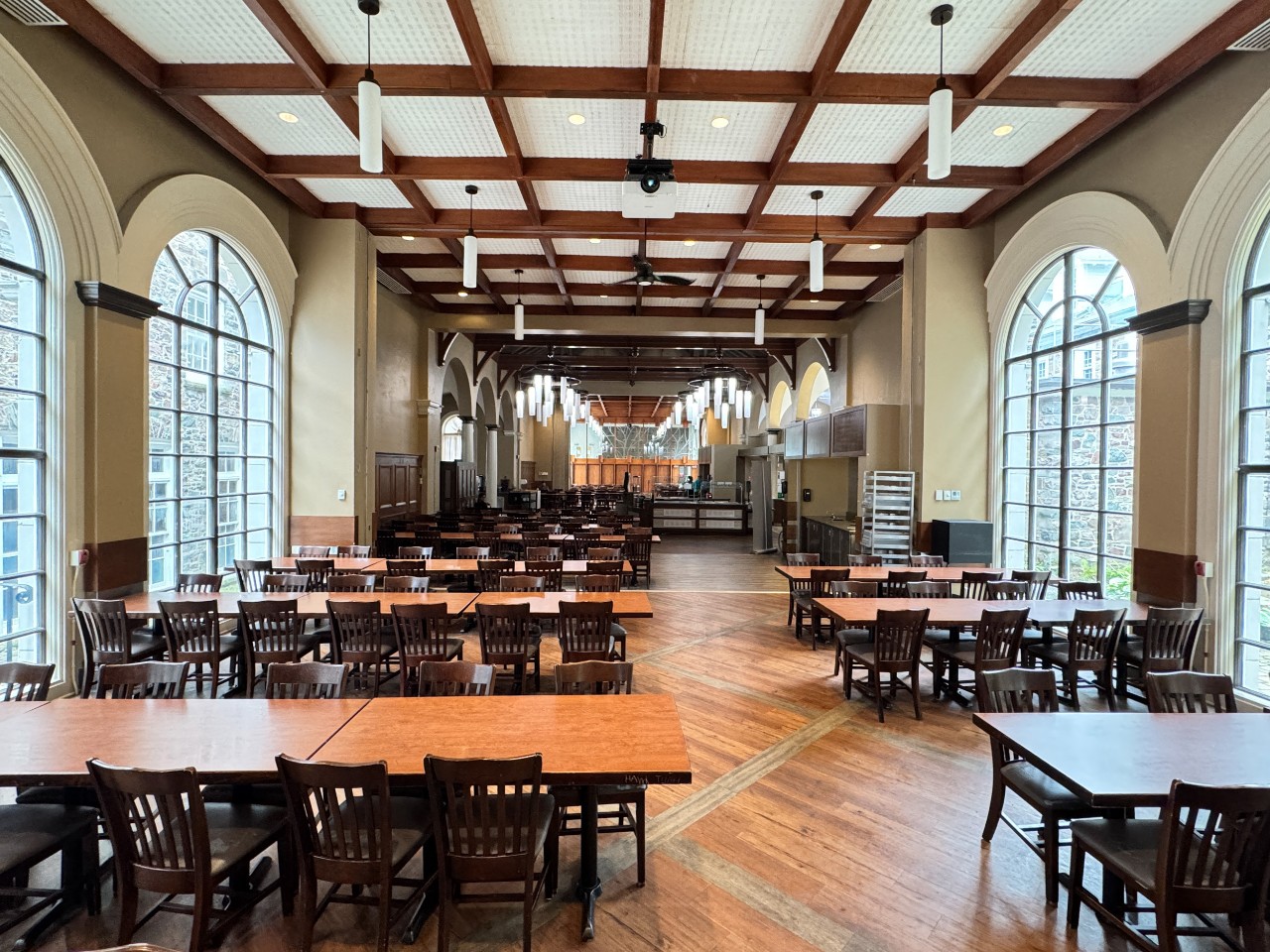 a wide photo showing the many long tables in the Shirreff dining hall