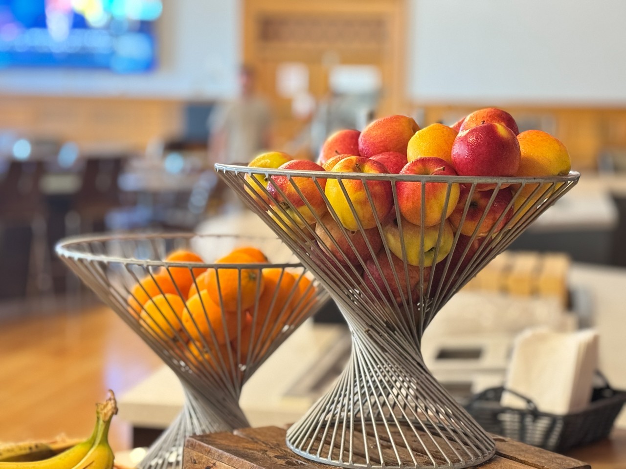 Baskets of fresh fruit sit on the counter, ready for students to grab and go