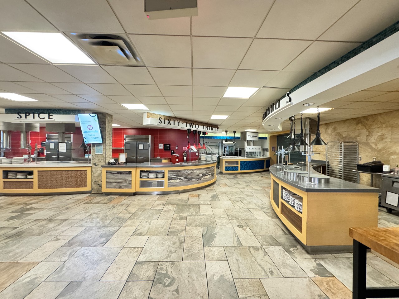 The servery has three different counters for hot food on the left side - one for the grill, one for special adventurous and international flavours, and another for mains and sides. On the right are the True Balance station and the pizza counter.