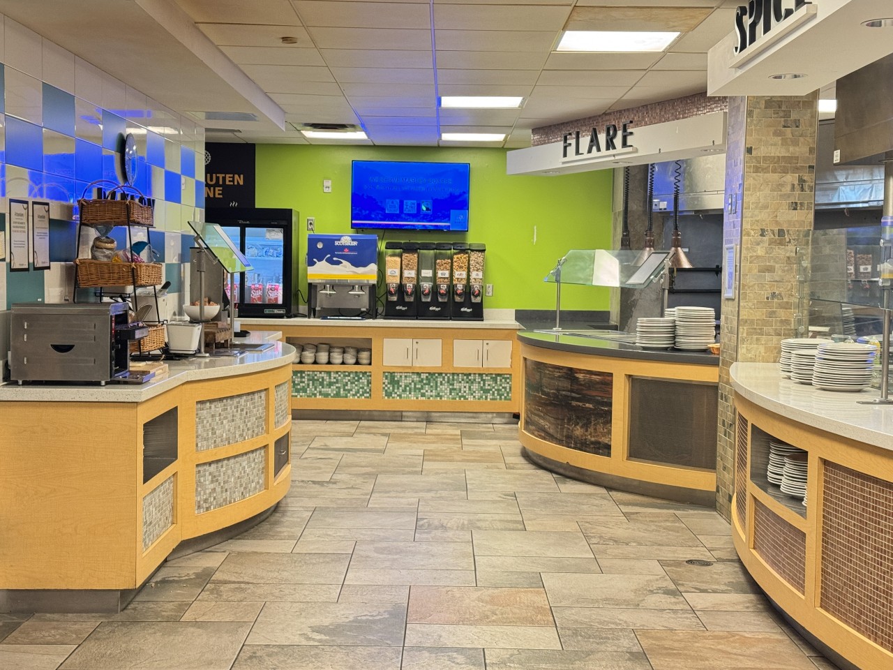 The servery has a counter with plenty of options for quick snacks, bread, and desserts on the left, and hot food items on the right
