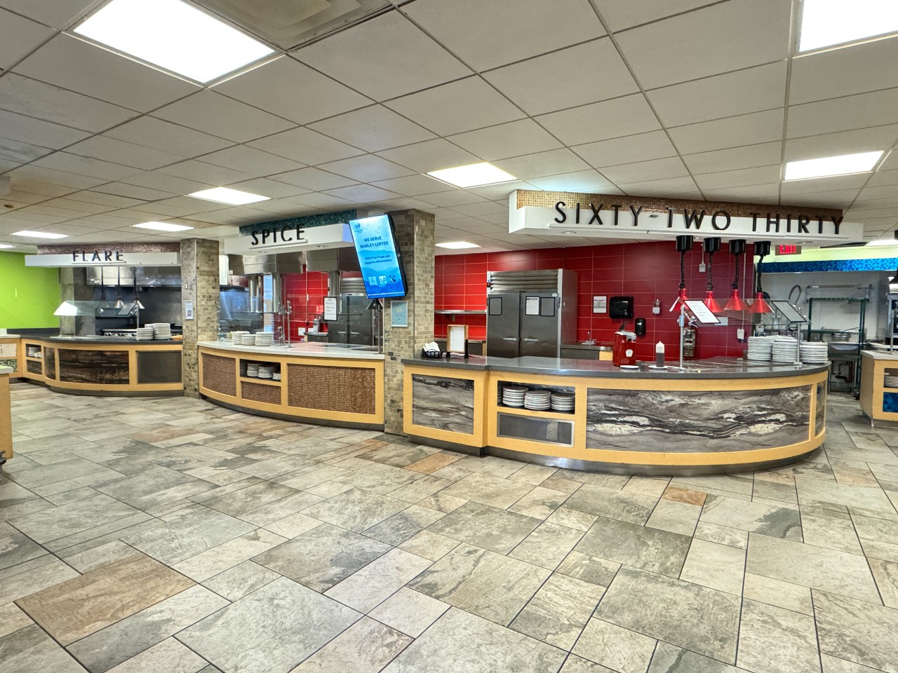 The servery has three different counters for hot food on the left side - one for the grill, one for special adventurous and international flavours, and another for mains and sides.