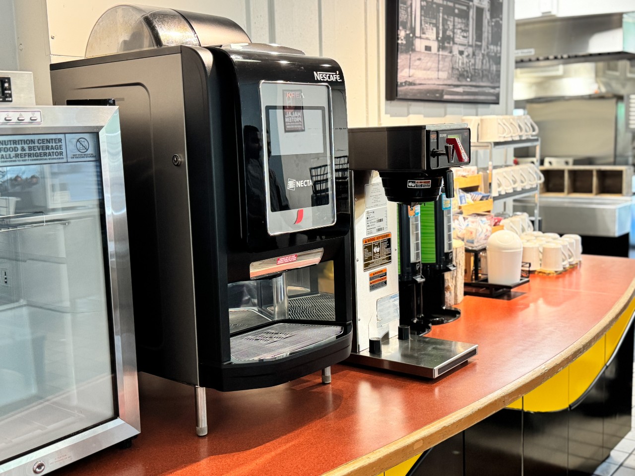 The coffee station features a gourmet coffee machine, hot water, tea, and everything you need to customize