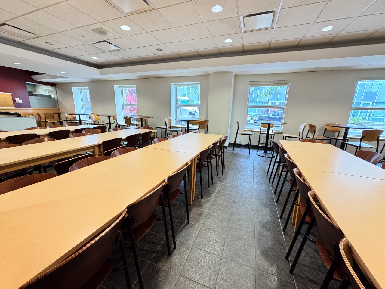 The seating area has long tables with plenty of chairs