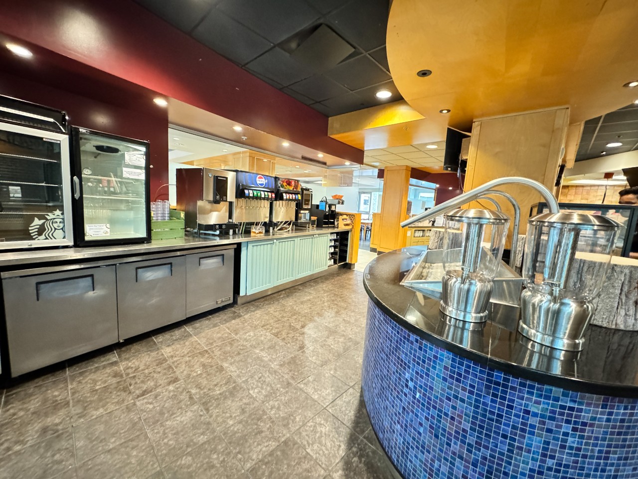 The no gluten station sits at the end of the drink counter with a dedicated fridge