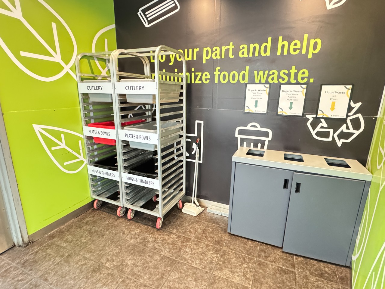 The dish return has bins for disposing of waste and basins to deposit dishes