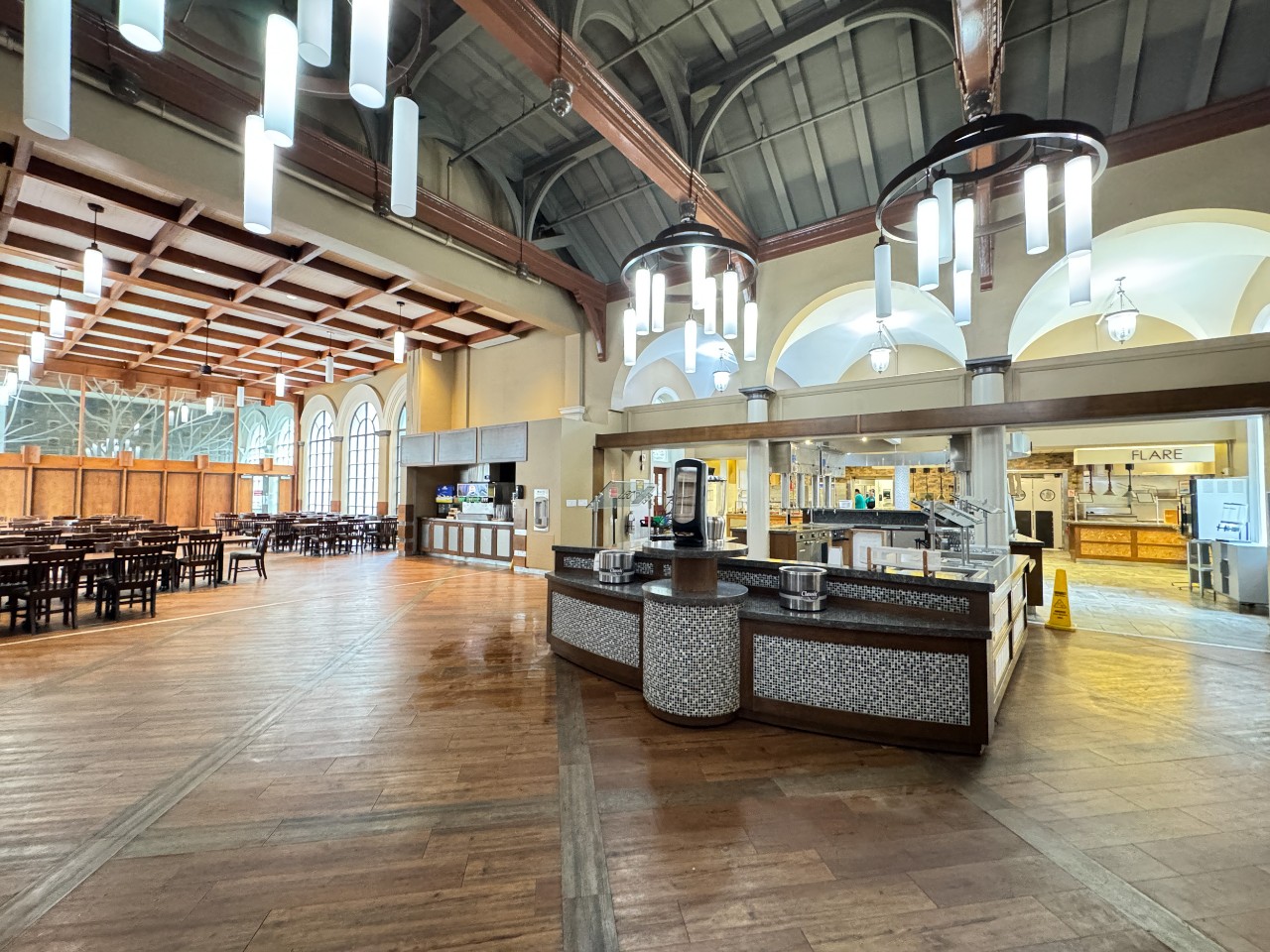 Upon entering, you are greeted with the made to order station and long wooden tables with chairs.