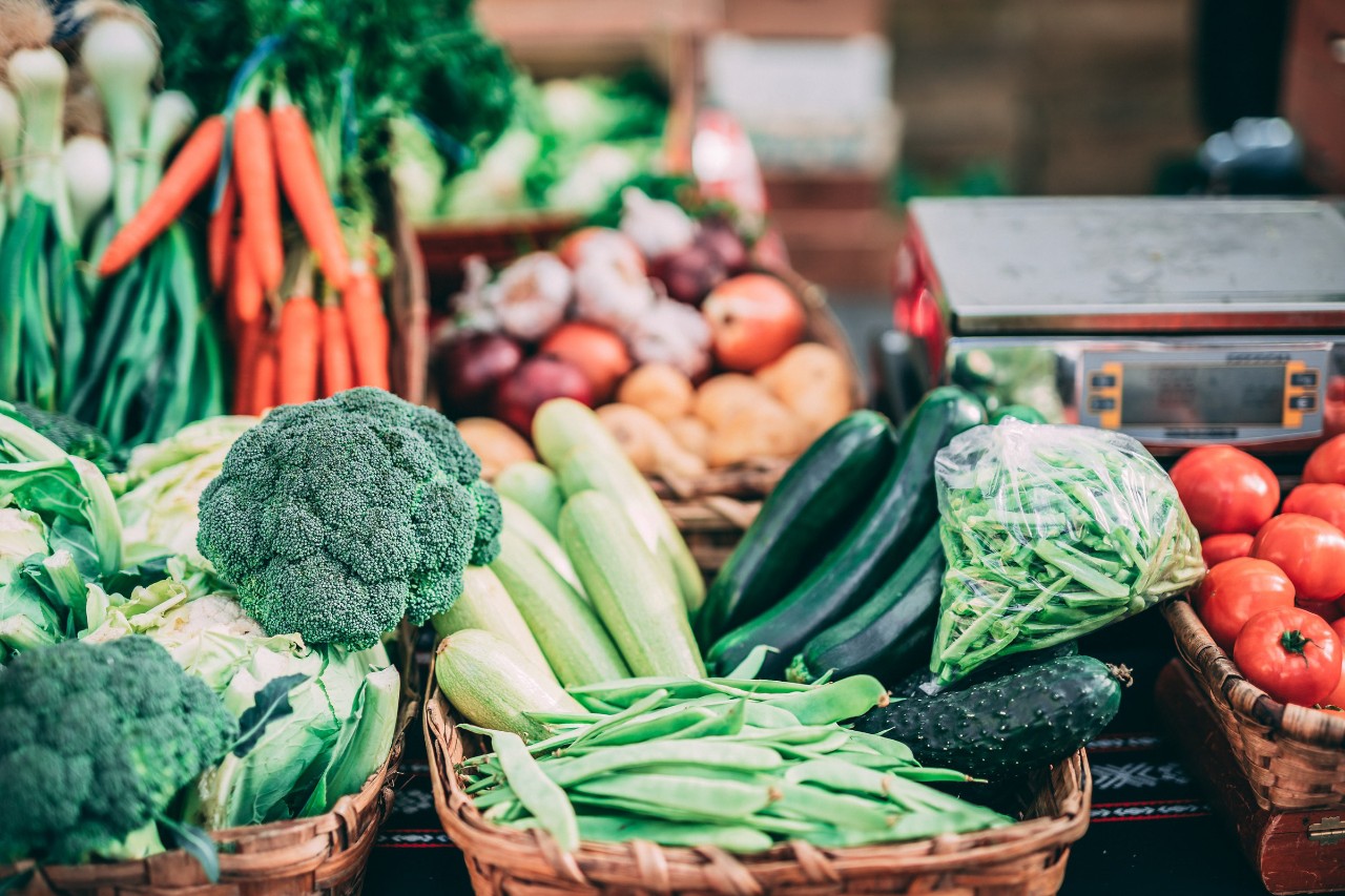 A collection of colourful fruits and vegetables in baskets