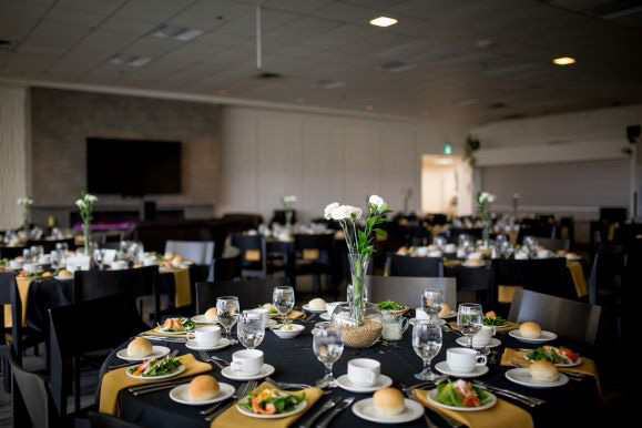A fully dressed table during an event in the Riverview Room is ready for guests to be seated