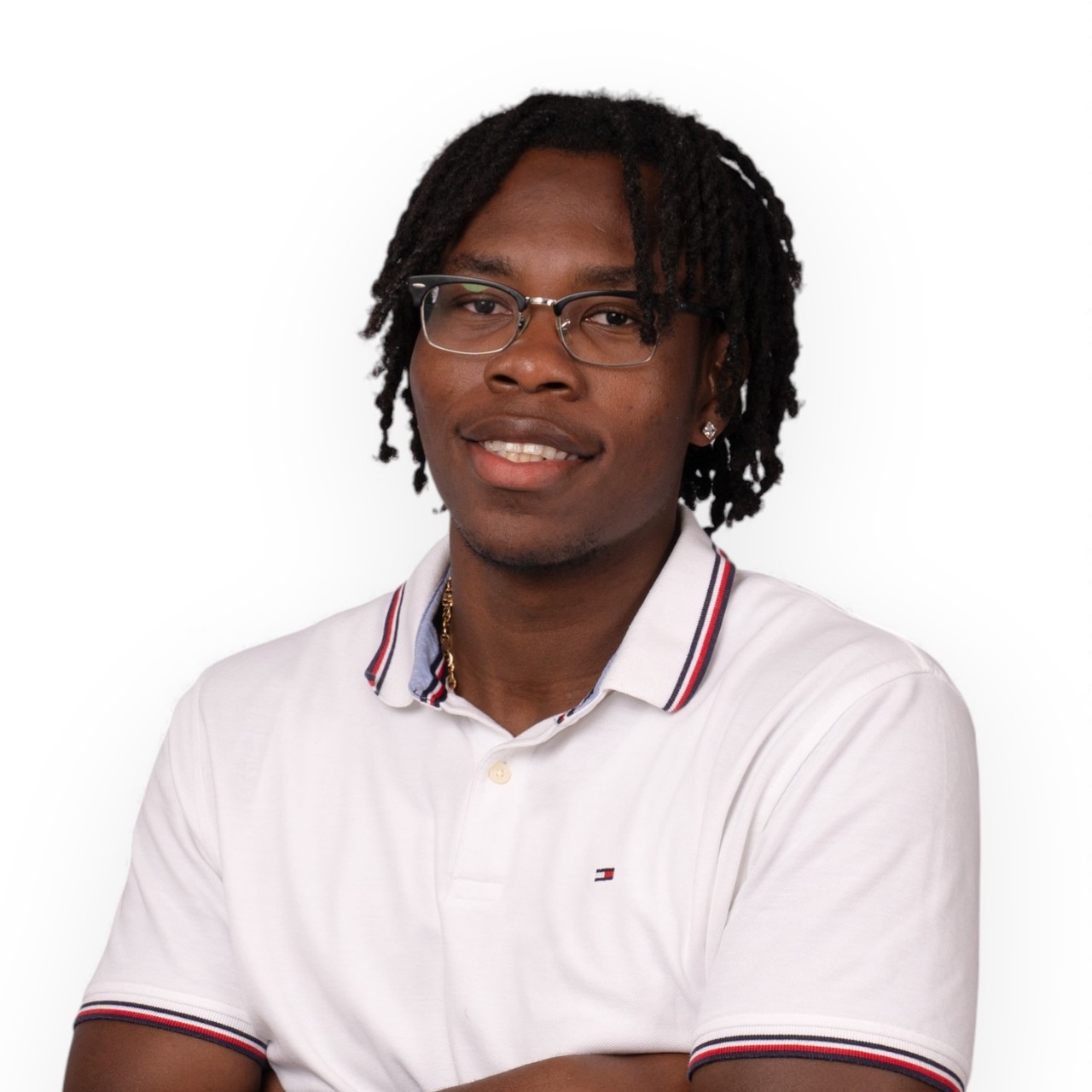 A portrait of Steven wearing glasses and a white short-sleeved shirt with stripes on the collar.