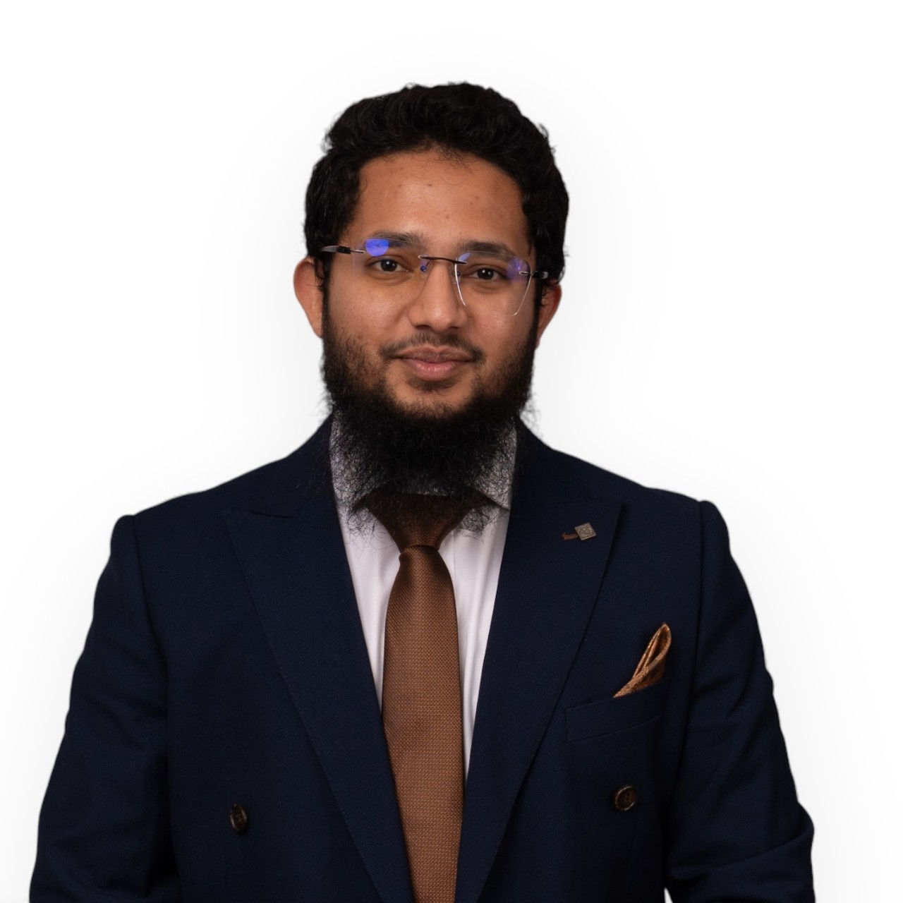 A portrait of Mohammed wearing glasses and a dark suit with brown tie and pocket square.