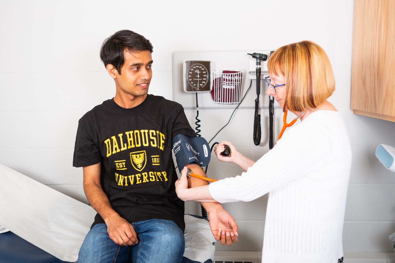 Student getting their blood pressure checked by a nurse