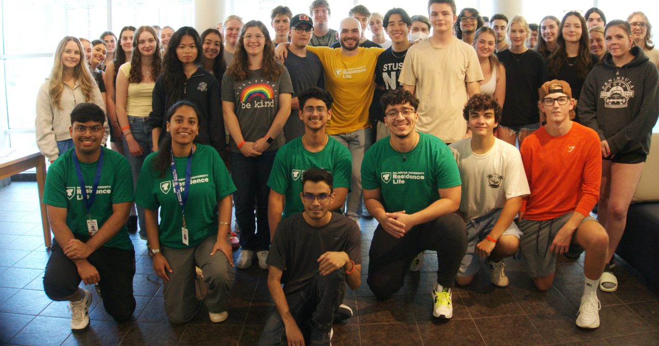 Students laughing at a desk